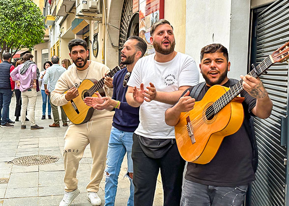 Locals Play the Guitar on Lisbon Street