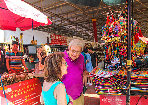 Tourists buying silk products